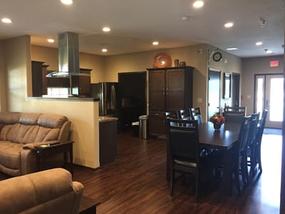 Bright common area with seating and dining setup