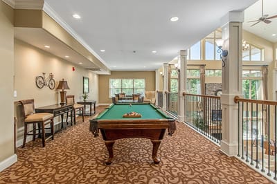 Interior common area with pool table and seating