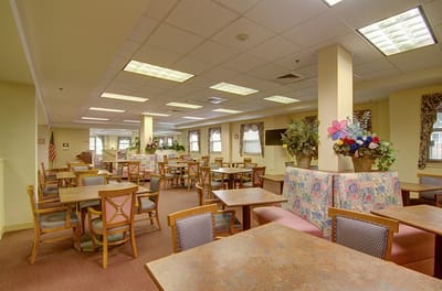 Dining area with tables and floral decorations