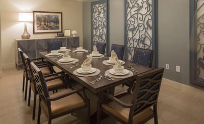 Elegant dining room setup with table and chairs