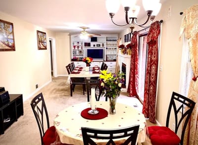 Bright common area with dining tables and flowers
