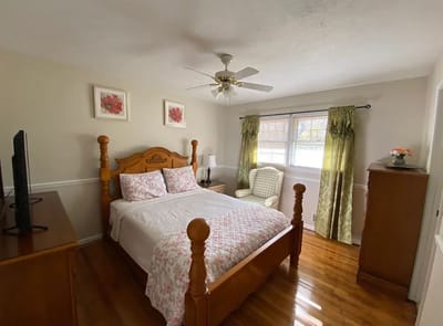 Cozy bedroom with wooden furniture and natural light