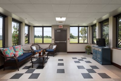 Bright common area with seating and view outside