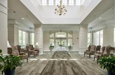 Bright lobby area with comfortable seating and plants