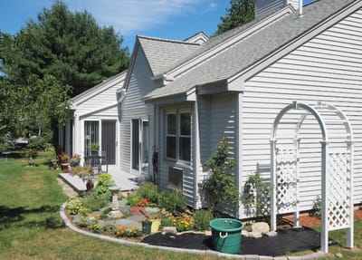 Exterior view of a facility building with gardens