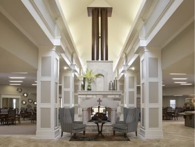 Interior view of a comfortable common area with seating and fireplace