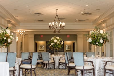Elegant dining area with tables and floral arrangements