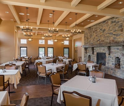 Elegant dining room with tables set for meals