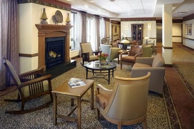 Interior common area with seating and a fireplace