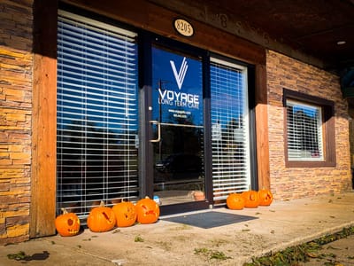 Front entrance of Voyage Long Term Care with pumpkins