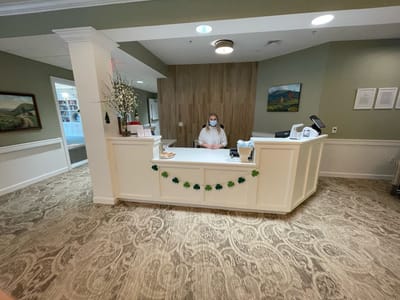 Reception area with a staff member at the desk