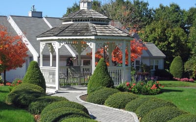 A gazebo surrounded by landscaped gardens