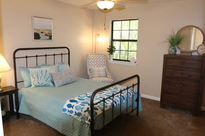 A cozy resident bedroom with blue decor