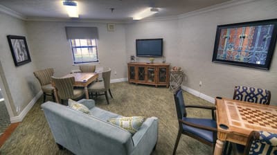 Interior common area with seating and games.