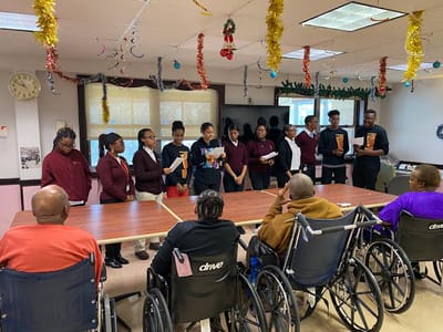 Residents enjoying a performance activity in a common area