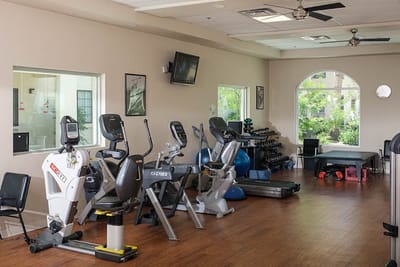 A well-equipped fitness room with exercise machines