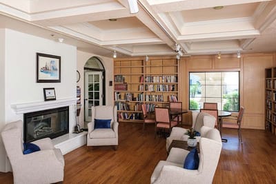 Common area with seating and bookshelves