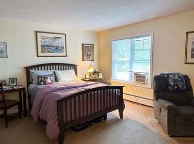 Cozy resident room with a bed and natural light
