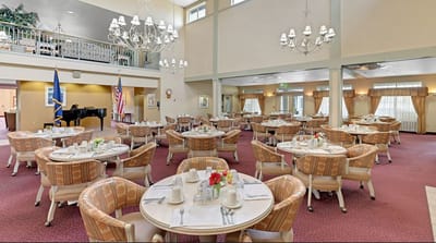 Spacious dining room set for a meal with elegant decor