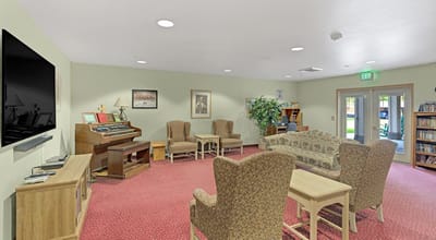 Interior common area with seating and piano
