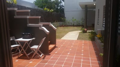 Outdoor space with patio furniture and garden area