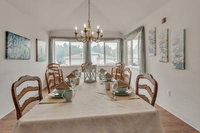 Dining area set for a meal with elegant decor
