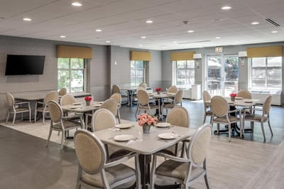 Dining room with tables and flower centerpieces