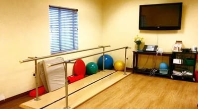 Rehabilitation room with equipment for therapy exercises