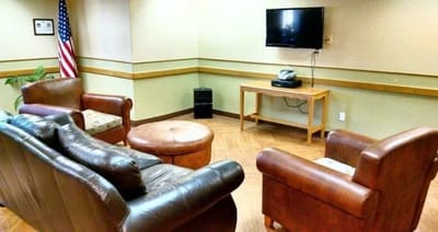 Cozy common area with seating and television