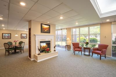 Bright common area with seating and fireplace