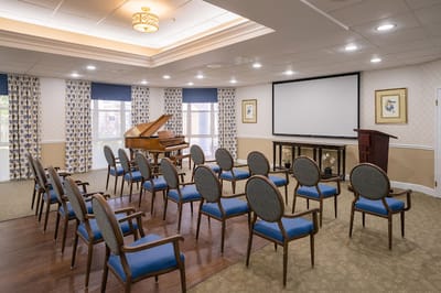 Empty activity room with chairs arranged for an event