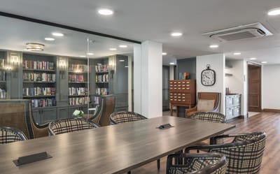 Interior view of a communal reading area with bookshelves
