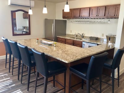 Modern kitchen space with bar seating and appliances