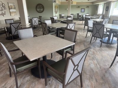 Dining area with empty tables and chairs