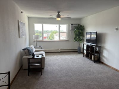 Bright and airy living area in a resident room