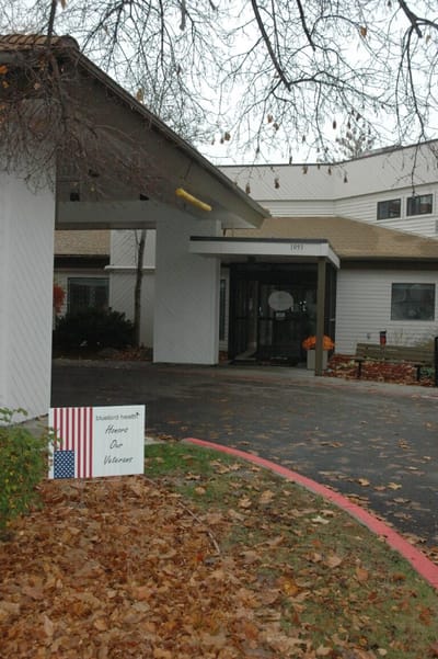 Entrance of Arbor Village at Hillcrest with seasonal decor