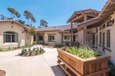 Outdoor garden area with seating and landscaping