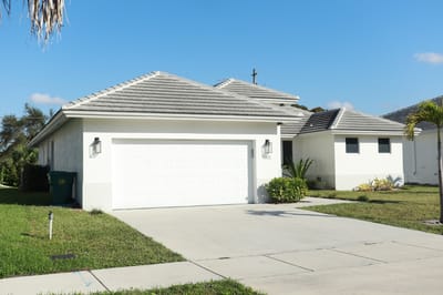 Exterior view of a single-story building with a driveway