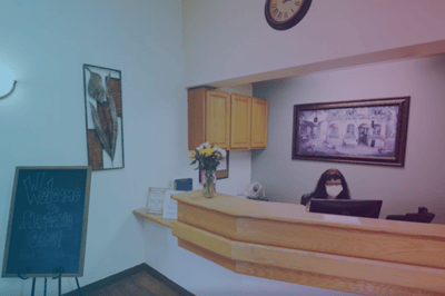 Reception area with staff member behind the desk