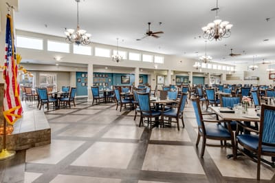 Bright dining room with tables and chairs