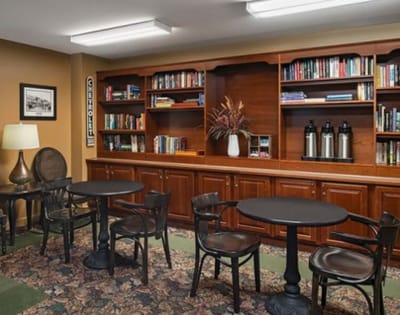 Interior common area with bookshelves and seating