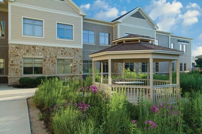 Exterior view of The Wellshire Morton Grove with a gazebo
