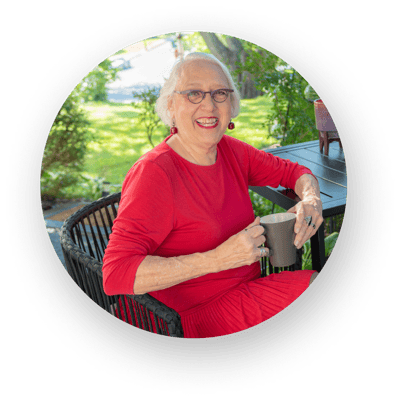 Resident enjoying coffee in a garden setting