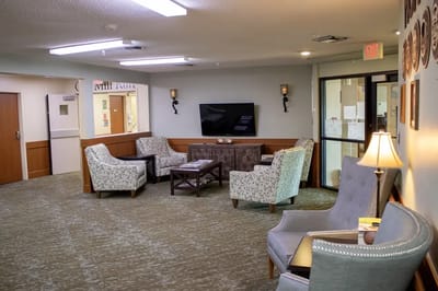 Cozy common area with seating and a TV