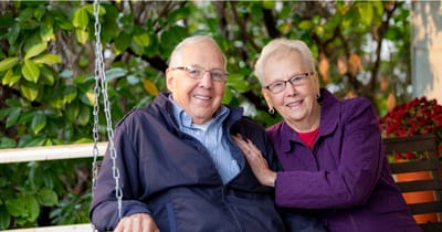 Couple enjoying time together on a swing