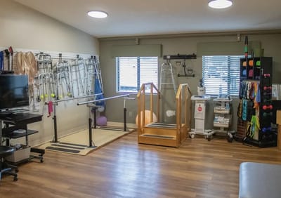 Interior view of a therapy room with exercise equipment