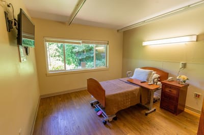 Private resident room with bed and window