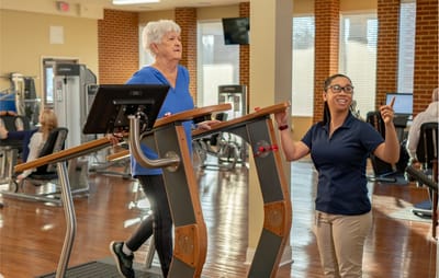 Residents participating in fitness activities in a gym