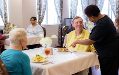 Residents enjoying a meal in the dining area