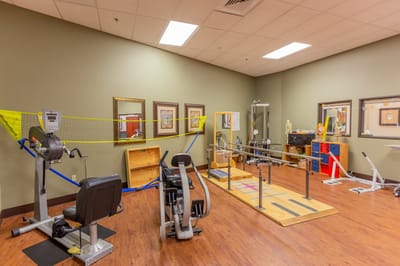 Rehabilitation gym with exercise equipment and therapy tools